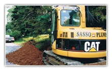 Sasso excavator and truck at work